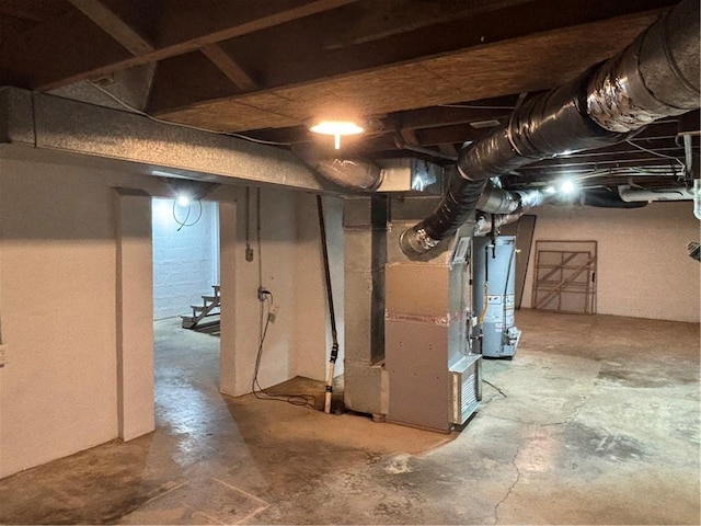 4202 Dr Greaves Rd, Grandview, MO 64030 - unfinished below grade area featuring water heater and heating unit