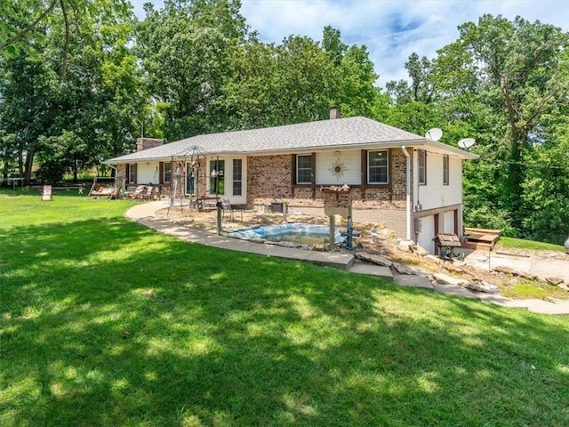 1490 216th St, Lathrop, MO 64465 - back of house with a chimney, brick siding, an attached garage, a lawn, and an outdoor pool