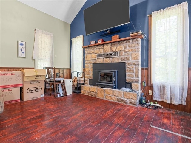 1490 216th St, Lathrop, MO 64465 - living room with wood finished floors, a stone fireplace, wainscoting, and high vaulted ceiling