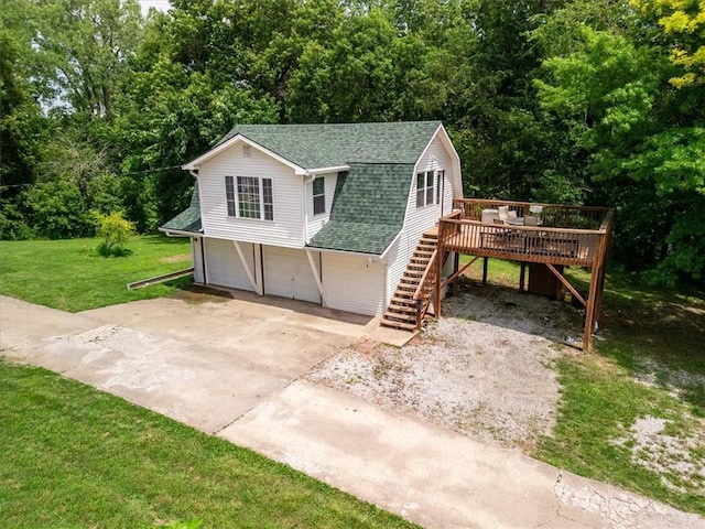 1490 216th St, Lathrop, MO 64465 - view of front of property featuring stairs, roof with shingles, an attached garage, a front yard, and a wooden deck