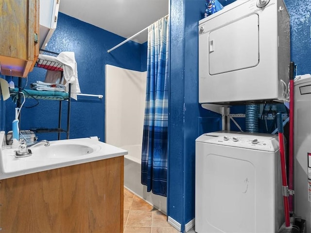 1490 216th St, Lathrop, MO 64465 - full bathroom with estacked washer and dryer, a textured wall, shower / bath combination with curtain, vanity, and tile patterned floors