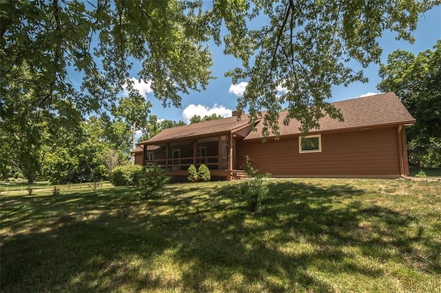 918 King St, Baldwin City, KS 66006 - rear view of house featuring a yard and a wooden deck