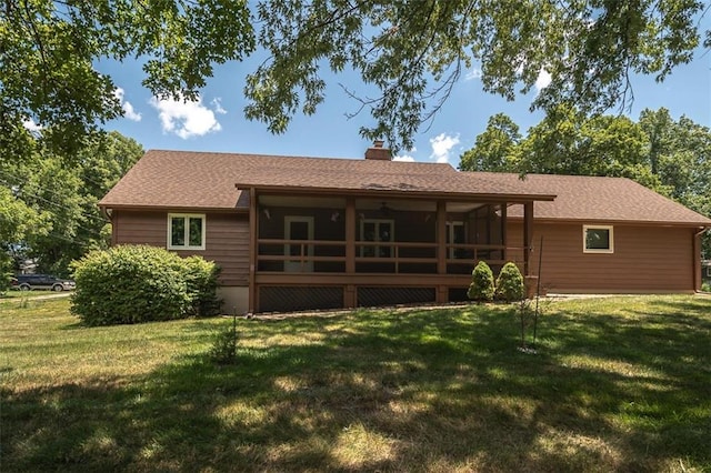 918 King St, Baldwin City, KS 66006 - back of property with a lawn, a chimney, and a deck