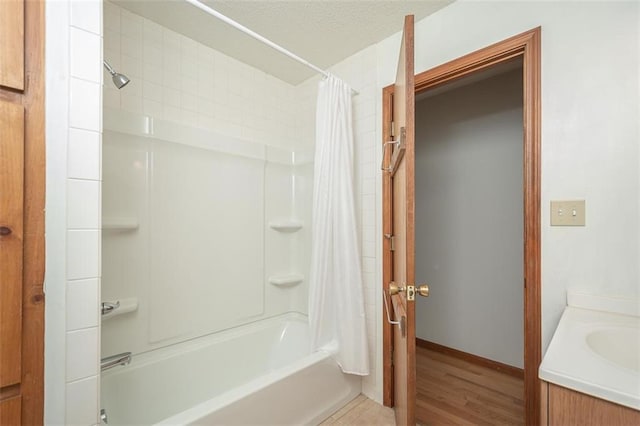 918 King St, Baldwin City, KS 66006 - full bath with shower / bath combo, vanity, and wood finished floors