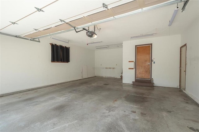 918 King St, Baldwin City, KS 66006 - garage featuring a garage door opener