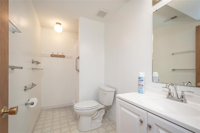 918 King St, Baldwin City, KS 66006 - bathroom with tile patterned floors, vanity, and a shower