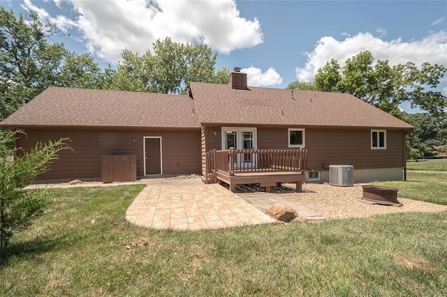 918 King St, Baldwin City, KS 66006 - back of house with a patio, a deck, a chimney, a yard, and roof with shingles