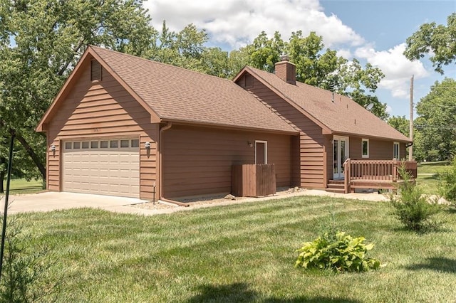 918 King St, Baldwin City, KS 66006 - view of front of property featuring a chimney, a front lawn, driveway, a wooden deck, and a shingled roof