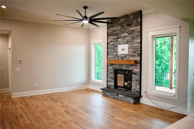 12820 N Arbor Way, Platte City, MO 64079 - unfurnished living room featuring ceiling fan, plenty of natural light, and light wood-style flooring