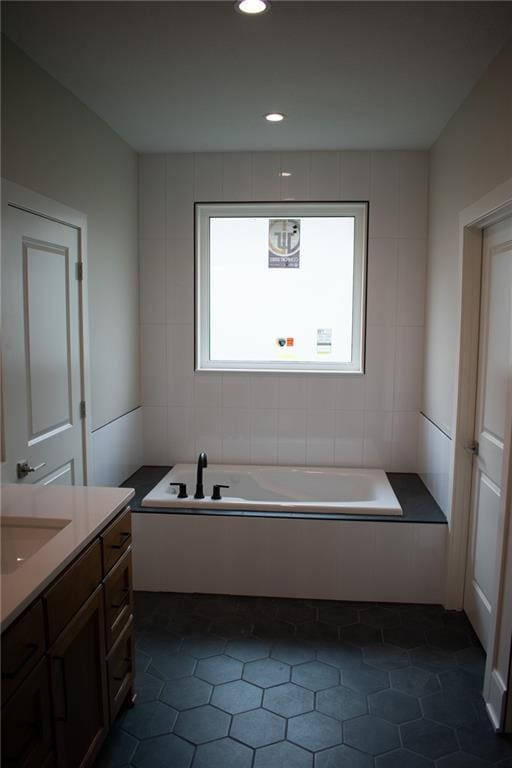 12820 N Arbor Way, Platte City, MO 64079 - bathroom with a garden tub, vanity, tile patterned flooring, and recessed lighting