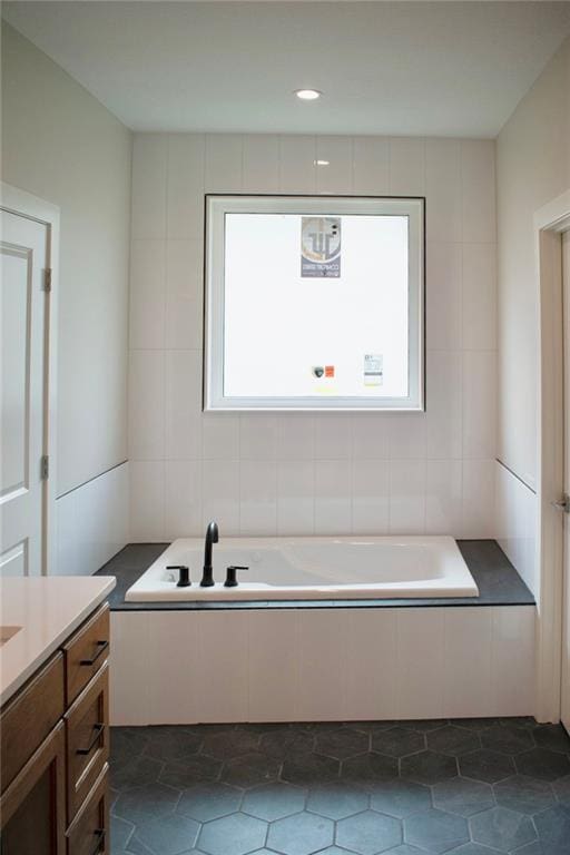 12820 N Arbor Way, Platte City, MO 64079 - full bath with a garden tub, vanity, and tile patterned floors