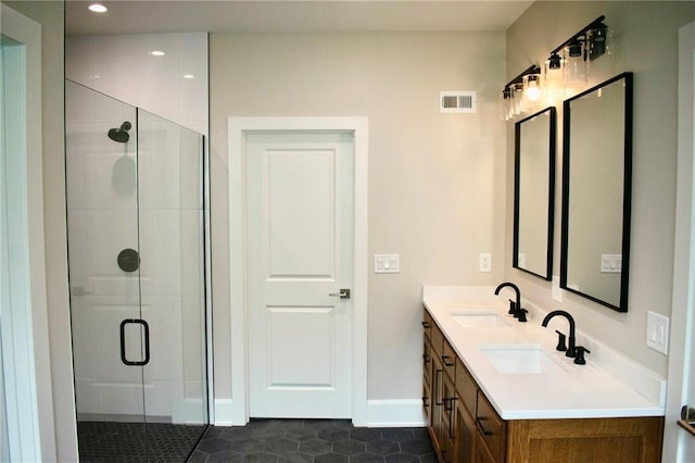 12820 N Arbor Way, Platte City, MO 64079 - bathroom with a shower stall, double vanity, tile patterned floors, and recessed lighting
