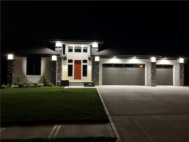 12820 N Arbor Way, Platte City, MO 64079 - prairie-style house featuring stone siding, concrete driveway, stucco siding, a garage, and a lawn