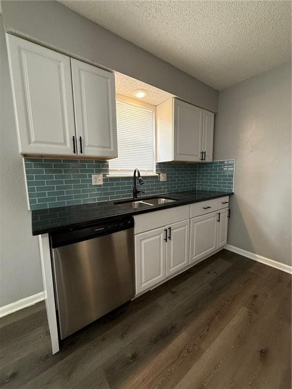 401-07 NE Highland Ln, Blue Springs, MO 64014 - kitchen featuring dishwasher, dark wood-style floors, a textured ceiling, backsplash, and white cabinetry