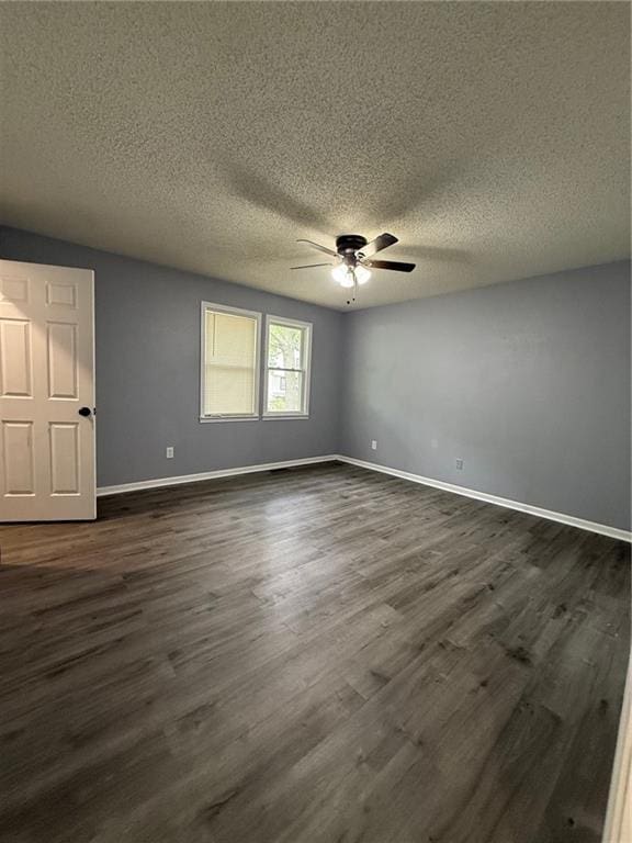 401-07 NE Highland Ln, Blue Springs, MO 64014 - spare room with a ceiling fan, dark wood-style floors, and a textured ceiling