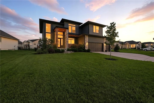 2768 SW 12th Ter, Lees Summit, MO 64081 - contemporary home featuring an attached garage, stone siding, concrete driveway, and a front yard