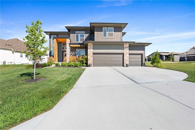 2768 SW 12th Ter, Lees Summit, MO 64081 - prairie-style house featuring driveway, a front lawn, and an attached garage