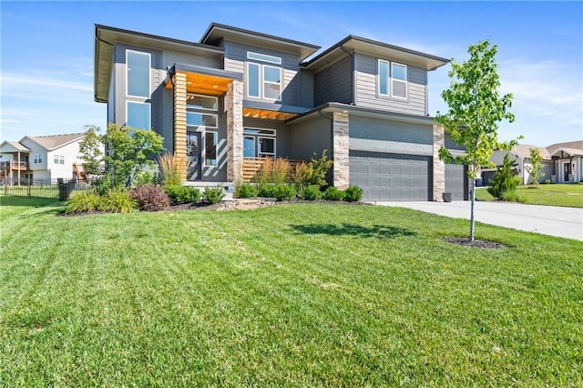 2768 SW 12th Ter, Lees Summit, MO 64081 - modern home with stone siding, a garage, driveway, and stucco siding