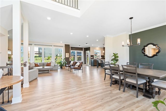 2768 SW 12th Ter, Lees Summit, MO 64081 - dining area featuring light wood-style flooring, a chandelier, recessed lighting, and ornamental molding