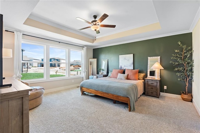 2768 SW 12th Ter, Lees Summit, MO 64081 - carpeted bedroom featuring a raised ceiling, ornamental molding, and a ceiling fan