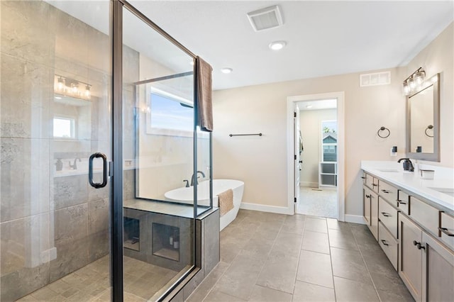 2768 SW 12th Ter, Lees Summit, MO 64081 - bathroom featuring double vanity, a freestanding tub, a shower stall, and plenty of natural light