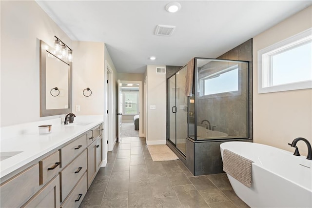 2768 SW 12th Ter, Lees Summit, MO 64081 - bathroom featuring double vanity, a freestanding bath, and a stall shower