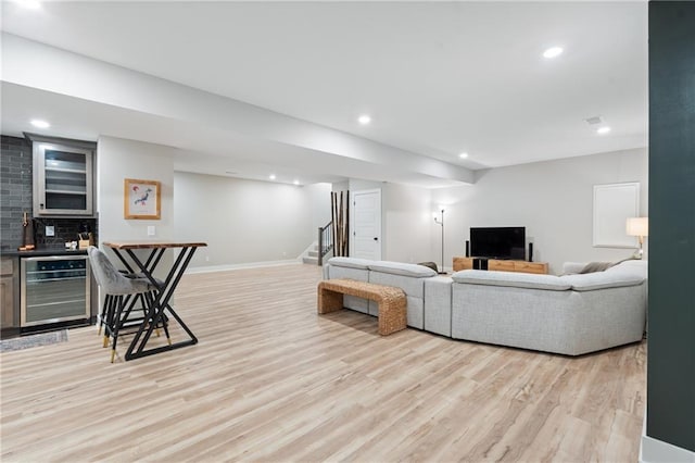 2768 SW 12th Ter, Lees Summit, MO 64081 - living area featuring wine cooler, stairway, light wood-style floors, recessed lighting, and bar