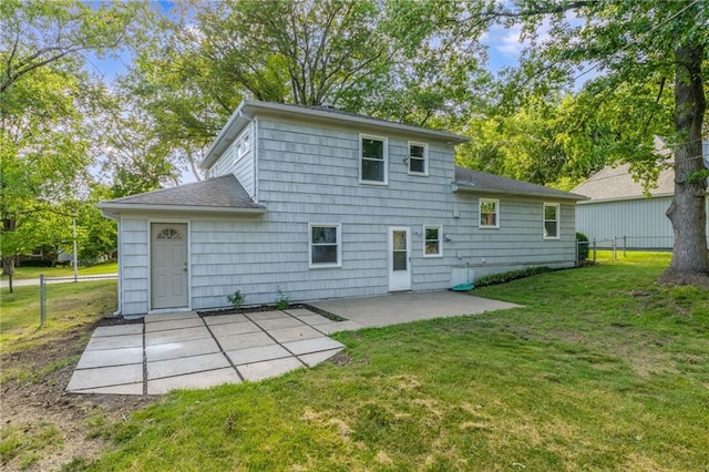 9909 Juniper Ln, Overland Park, KS 66207 - back of property featuring a patio, a lawn, and roof with shingles