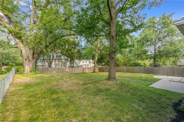 9909 Juniper Ln, Overland Park, KS 66207 - fenced backyard featuring a patio
