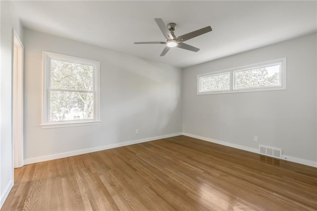 9909 Juniper Ln, Overland Park, KS 66207 - spare room featuring light wood-type flooring and ceiling fan