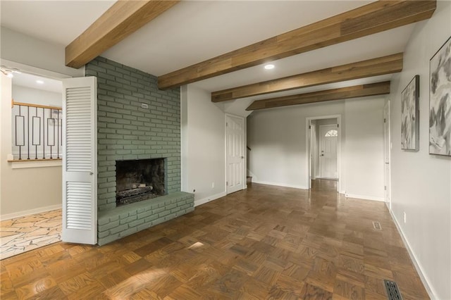 9909 Juniper Ln, Overland Park, KS 66207 - unfurnished living room with a brick fireplace, recessed lighting, and beamed ceiling