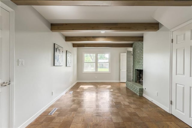 9909 Juniper Ln, Overland Park, KS 66207 - unfurnished living room featuring beamed ceiling and a brick fireplace