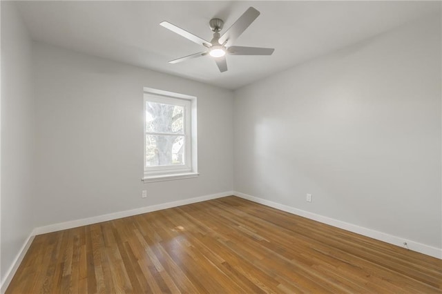 9909 Juniper Ln, Overland Park, KS 66207 - spare room with wood finished floors and a ceiling fan