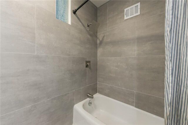 9909 Juniper Ln, Overland Park, KS 66207 - full bathroom featuring shower / bath combo with shower curtain
