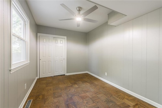 9909 Juniper Ln, Overland Park, KS 66207 - unfurnished bedroom featuring a ceiling fan and a closet