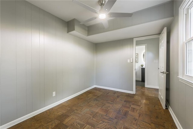 9909 Juniper Ln, Overland Park, KS 66207 - empty room with a ceiling fan and a decorative wall