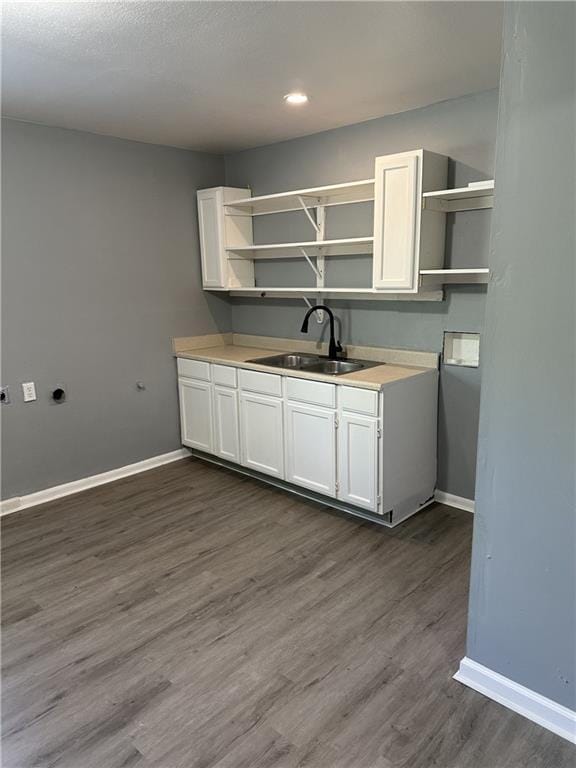 11001 Ewing Ave, Kansas City, MO 64134 - kitchen featuring open shelves, white cabinetry, dark wood-style flooring, and recessed lighting