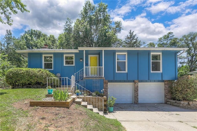 1921 SW 4th St, Lees Summit, MO 64081 - single story home with a garage, concrete driveway, a chimney, and board and batten siding