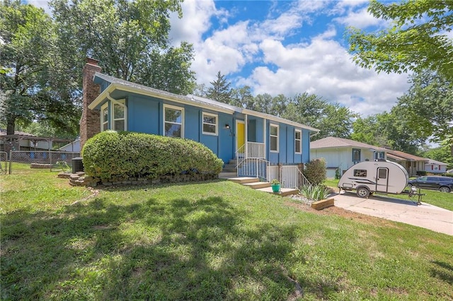 1921 SW 4th St, Lees Summit, MO 64081 - view of front facade featuring a chimney and driveway
