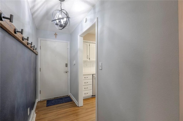 1921 SW 4th St, Lees Summit, MO 64081 - entryway featuring light wood-style floors and a chandelier