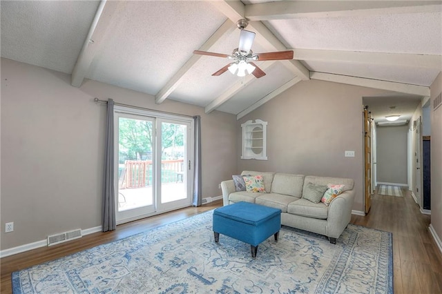 1921 SW 4th St, Lees Summit, MO 64081 - living room with wood finished floors, a ceiling fan, and a textured ceiling