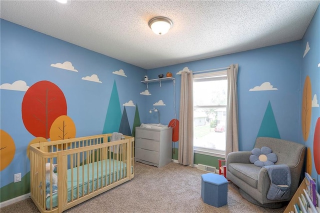 1921 SW 4th St, Lees Summit, MO 64081 - bedroom featuring a nursery area, carpet flooring, and a textured ceiling