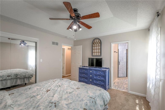 1921 SW 4th St, Lees Summit, MO 64081 - carpeted bedroom with ceiling fan, a closet, and a textured ceiling