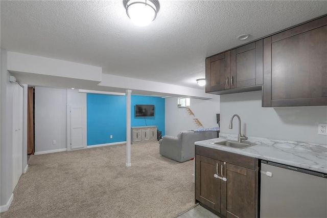 1921 SW 4th St, Lees Summit, MO 64081 - kitchen featuring dark brown cabinetry, open floor plan, light carpet, a textured ceiling, and fridge