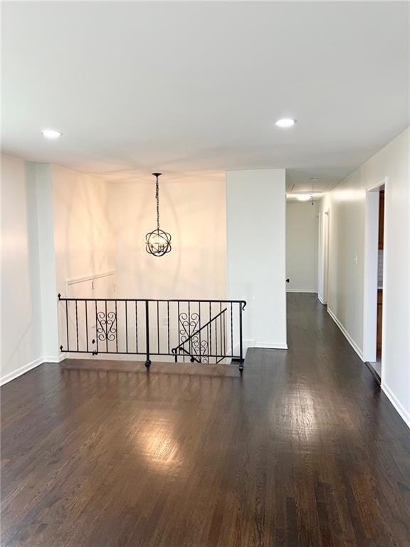 10806 W 96th St, Overland Park, KS 66214 - empty room featuring dark wood-style flooring and recessed lighting