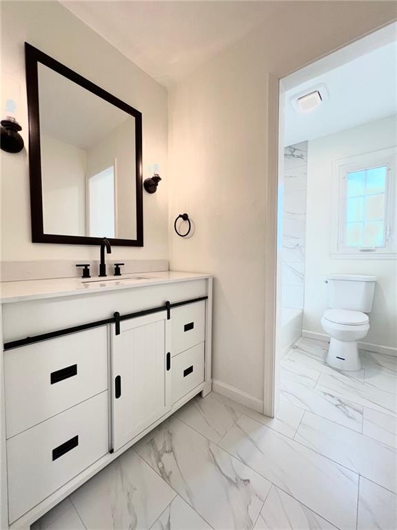 10806 W 96th St, Overland Park, KS 66214 - full bath with vanity, marble finish floors, and shower / tub combination