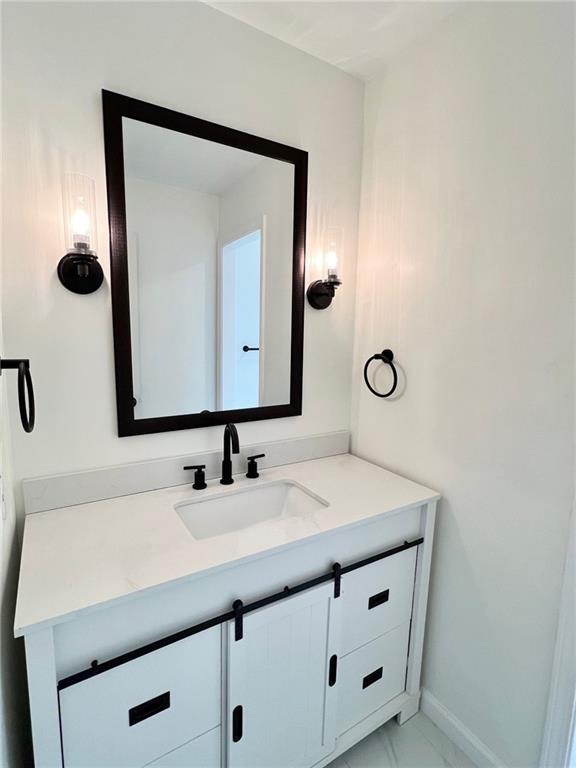 10806 W 96th St, Overland Park, KS 66214 - bathroom featuring vanity and marble finish floors