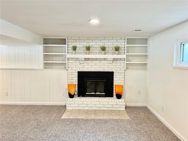 10806 W 96th St, Overland Park, KS 66214 - unfurnished living room featuring carpet floors, built in features, and a fireplace