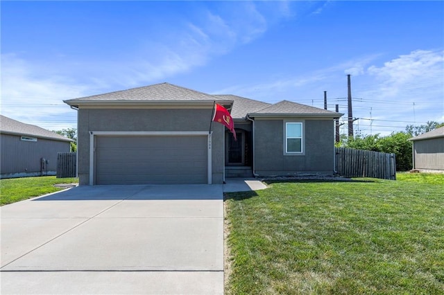 21904 Crystal Ave, Peculiar, MO 64078 - view of front of home with an attached garage, concrete driveway, and stucco siding