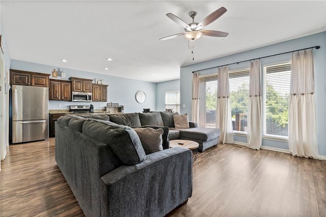 21904 Crystal Ave, Peculiar, MO 64078 - living area with a ceiling fan, dark wood-style floors, and recessed lighting